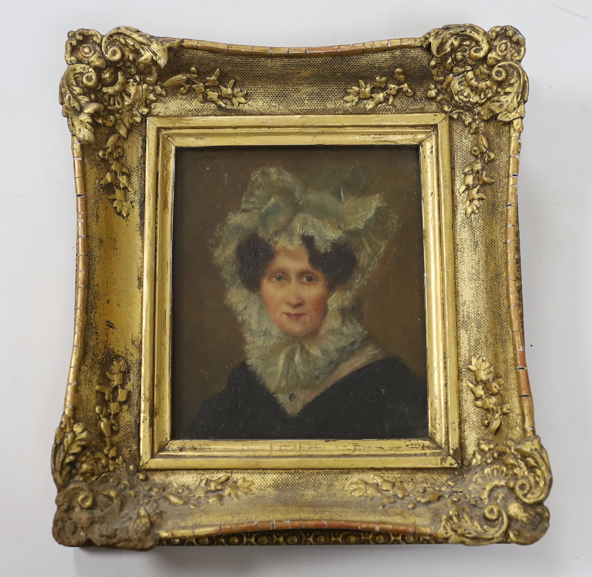19th century English School, oil on canvas, Portrait of a lady wearing a bonnet, 16 x 13cm, ornate gilt frame